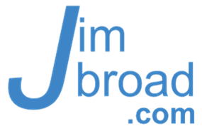 dynamic JimBroad digital, thoughtful expression, designing user interfaces, photorealistic, sleek urban office with city view, highly detailed, digital screens displaying data, high resolution, vibrant colors, fluorescent lighting, shot with a macro lens.